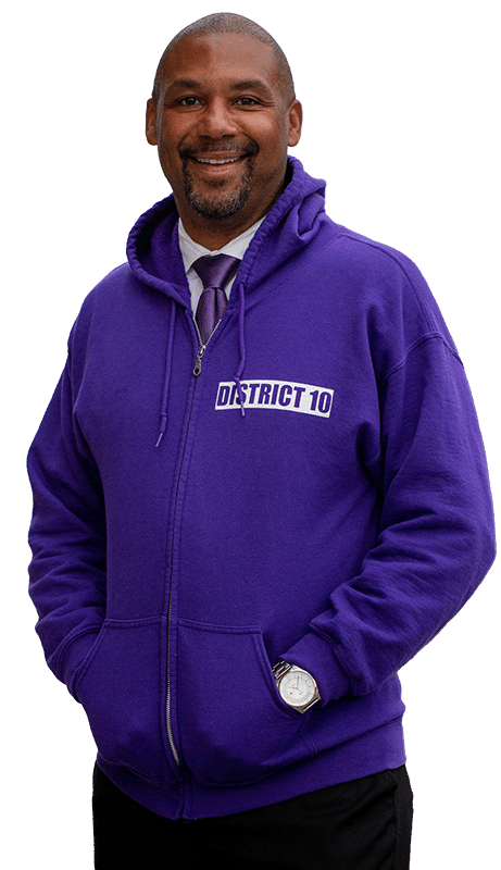 Shamann Walton in a purple hoodie that says "District 10" on it